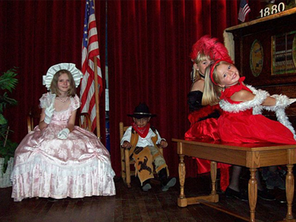 1880 Town Costume Rentals - Kids on stage at the piano